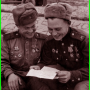 З.Л. Асфандияров и В.М. Пермяков читают письмо, 1941-1945 гг.
